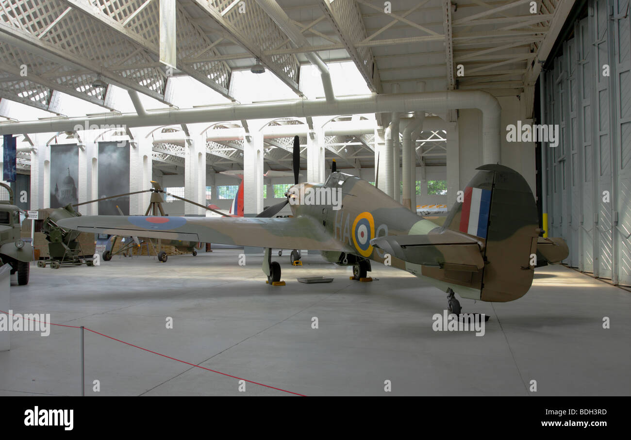 In it`s camouflage livery this fine example of the Hawker Hurricane Mk IIb fighter,currently in Hangar 4 IWM Duxford,England. Stock Photo